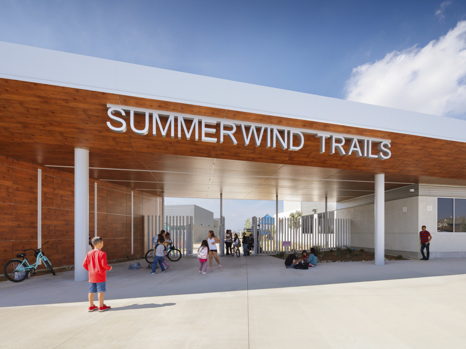 front entry to school with Summerwind Trails sign