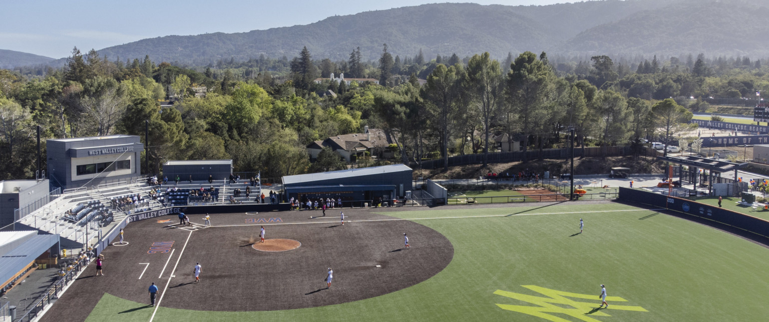 Aerial view from right field looking to home plate, bleachers and box seating labeled West Valley College. Santa Cruz Mountains behind