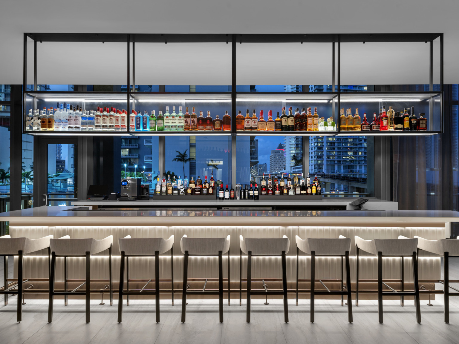The bar is illuminated like a piece of art enclosed by the night sky