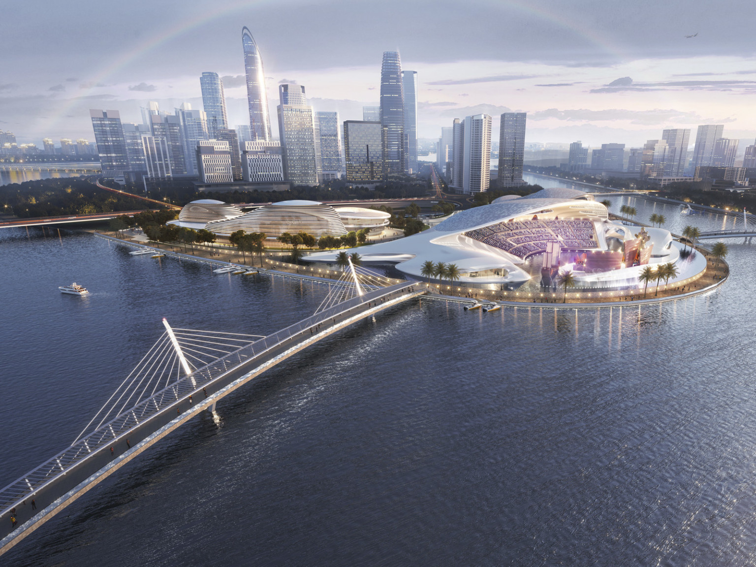 Xiamen Cultural Complex in China. Bridges connect to land with white sweeping multipurpose event center and stadium seating