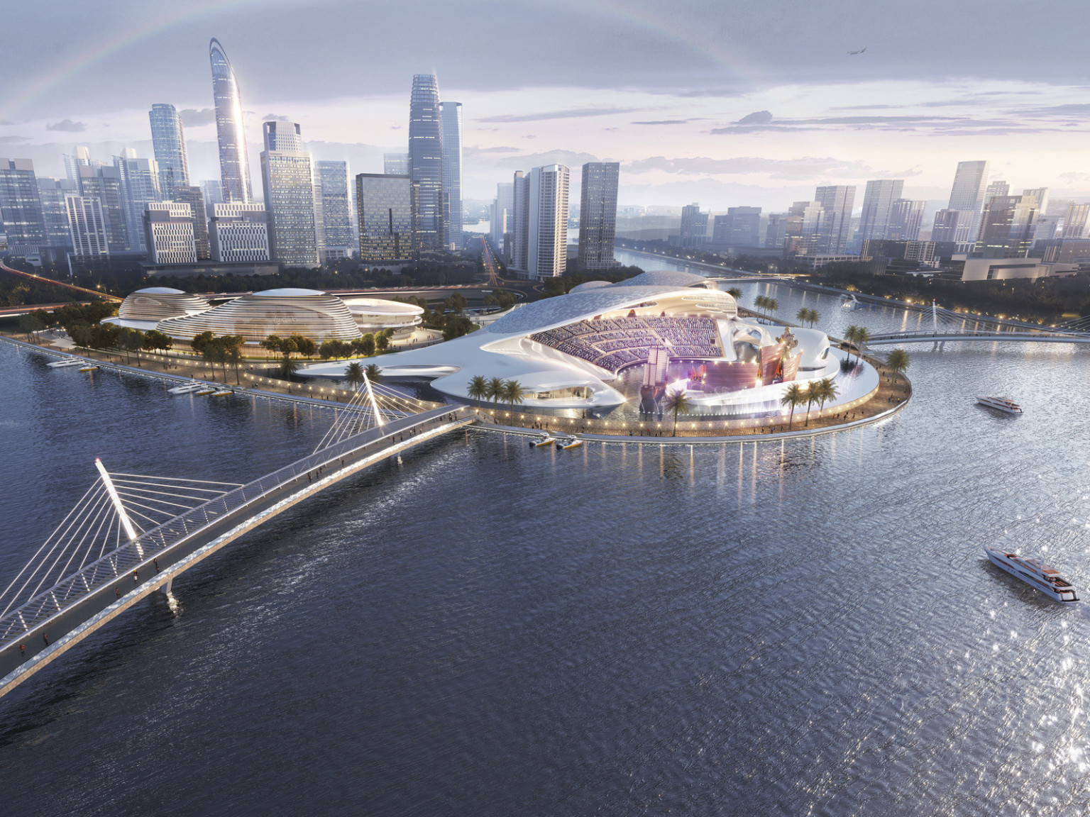 Xiamen Cultural Complex in China. Bridges connect to land with white sweeping multipurpose event center and stadium seating