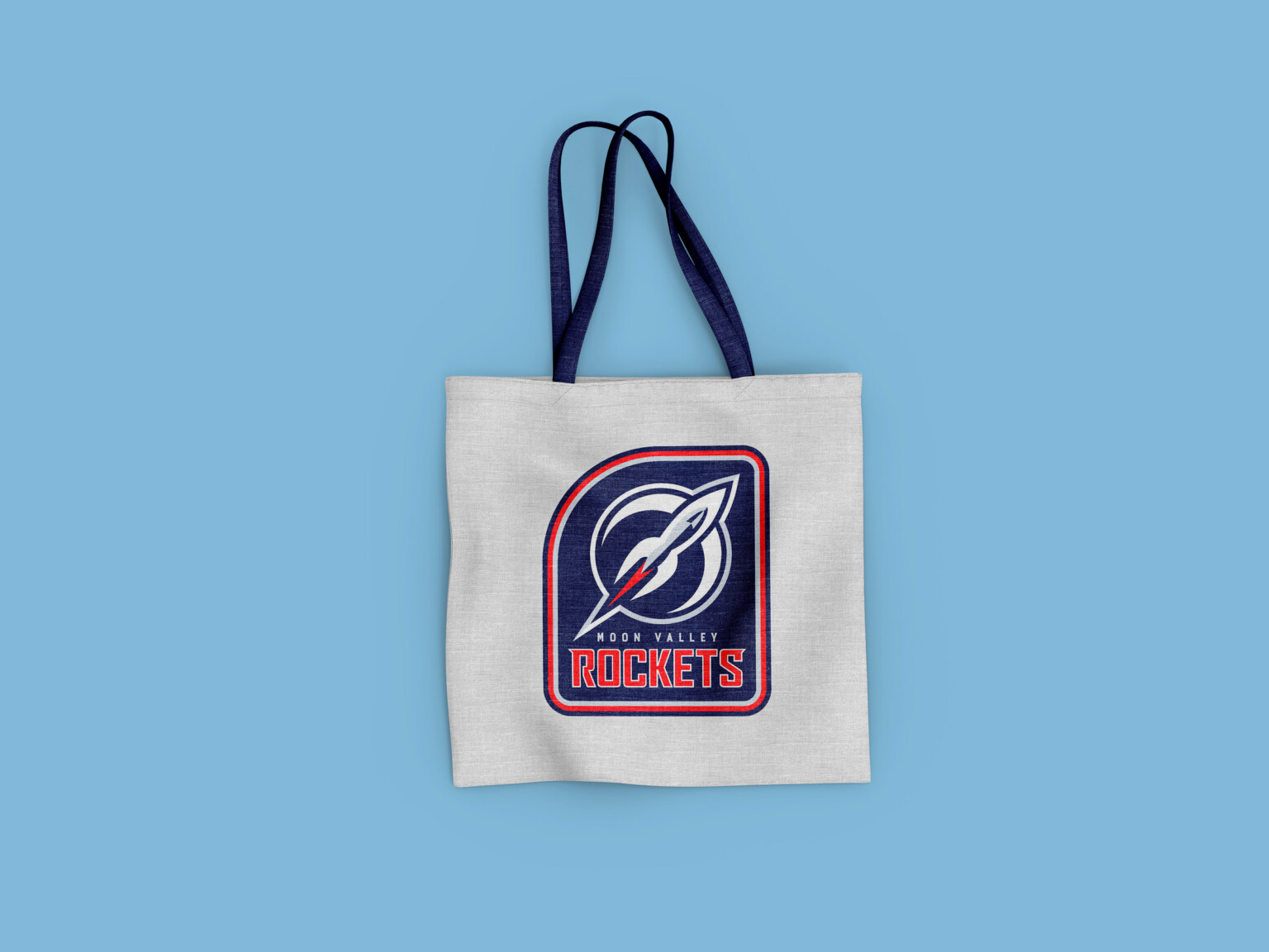 White tote bag with Rockets written on it and dark blue logo with red accents