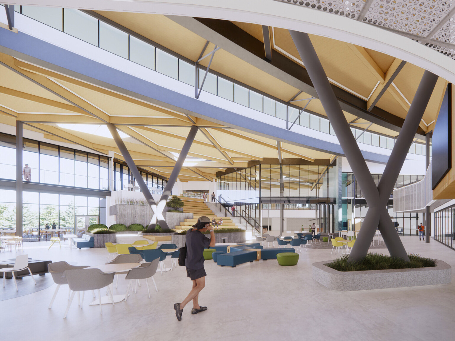 Interior double height lobby space in school. Biophilia elements, plant wall, mixed colorful seating. Mass timber wood, large windows