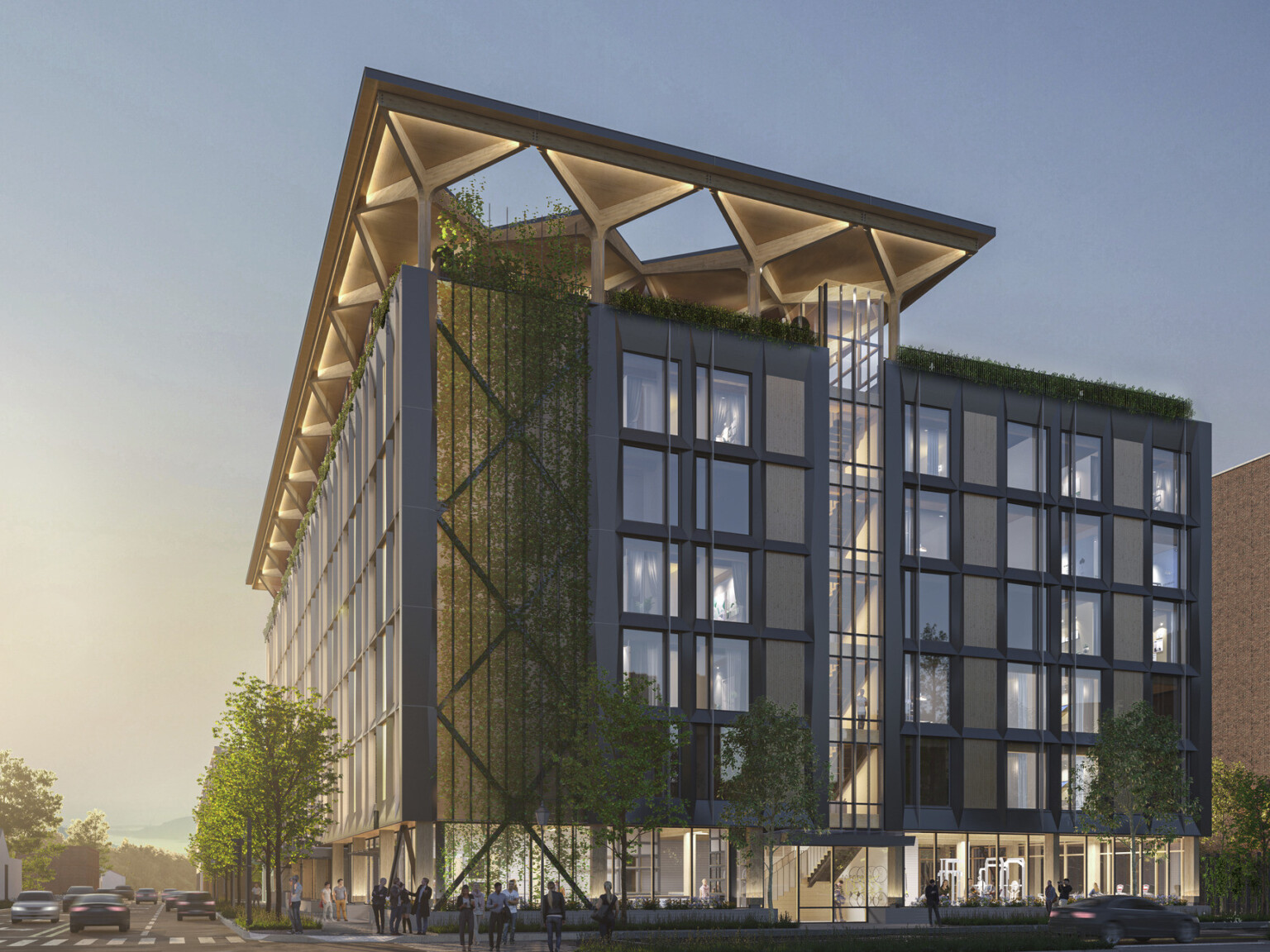 A midrise building with a blackened steel façade and timber infill with an arched timber canopy on a glassed-in rooftop A midrise building with a blackened steel façade and timber infill with an arched timber canopy on a glassed-in rooftop