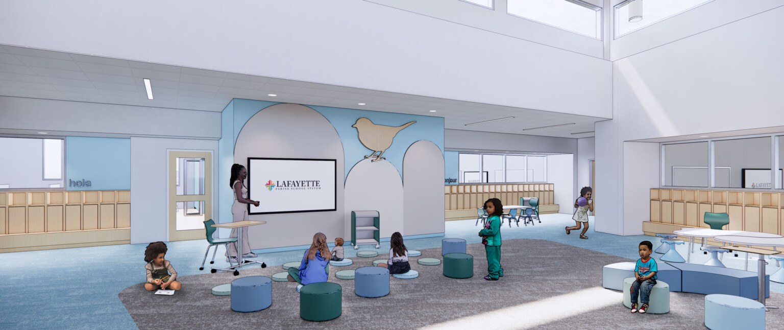 Teacher in flexible learning space in Double height common area. Clerestory windows, mural of bird silhouette, screen in wall