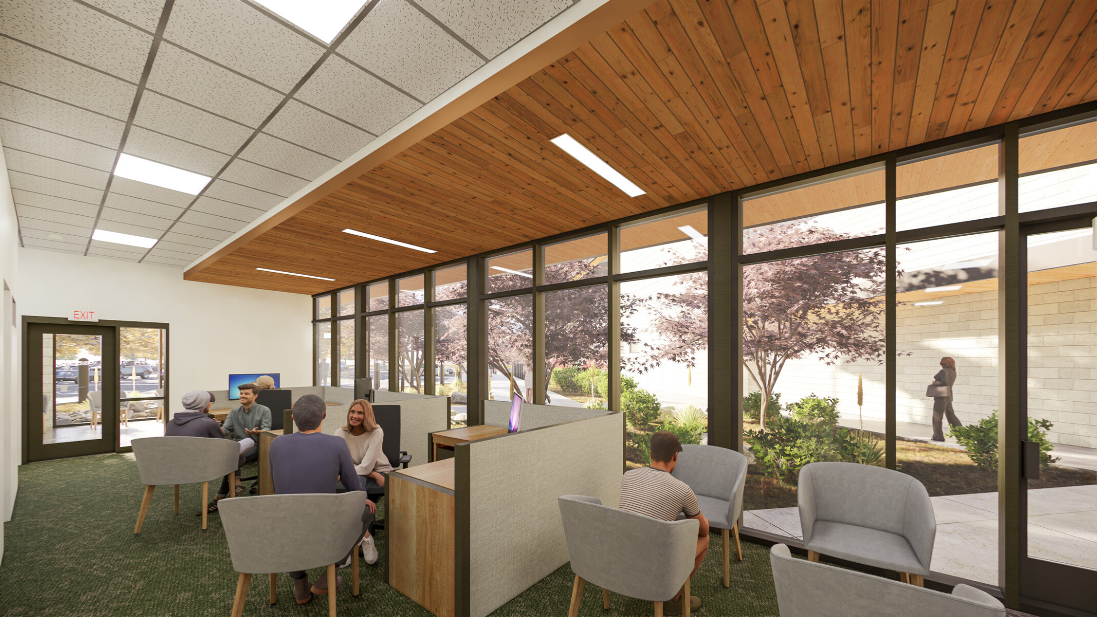 Release area of Yavapai County Criminal Justice Center. Seating areas in the front, natural materials, floor to ceiling windows, wood panel accent, daylighting throughout
