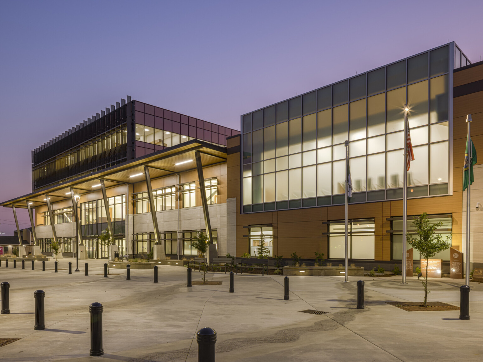 The main entrance in the four-story central tower of Marysville Civic Campus welcomes residents and visitors, sets a new architectural standard for the city and engages with an adjacent city park, main entrance in the four-story central tower, and employs floor-to-ceiling privacy windows on the upper level